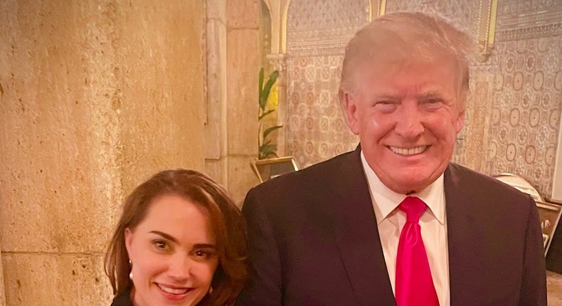 Deborah Adeimy, who is running for Congress in Florida, poses with former President Donald Trump at Mar-a-Lago.