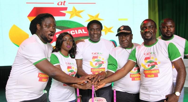 Daddy Showkey(far left), Mr Ibu (second right) and top staff of GOtv