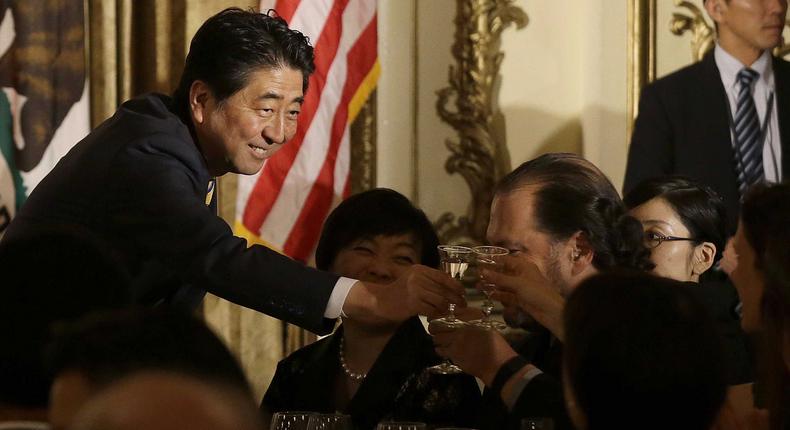 Japanese Prime Minister Shinzo Abe, shown here toasting guests in San Francisco in 2015, is on a whirlwind pacific tour.