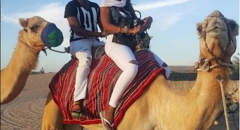 Timi Dakolo and wife Busola Dakolo atop a Camel