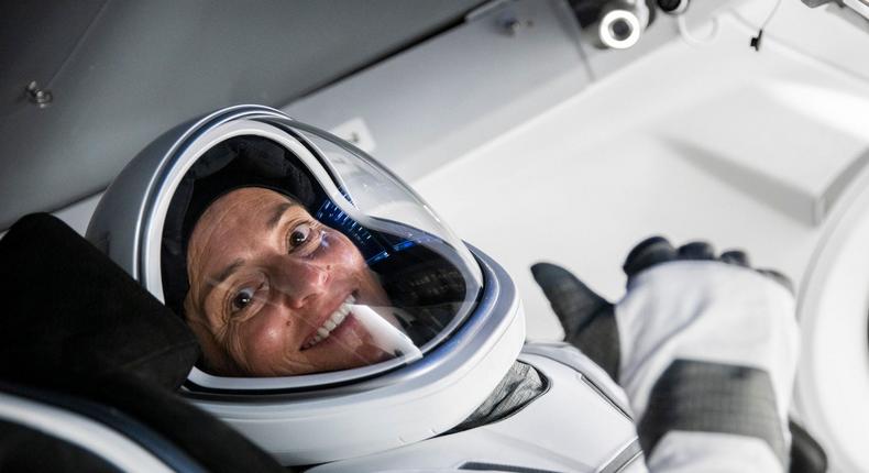 Nicole Aunapu Mann gives thumbs up during a Crew Dragon cockpit training session at SpaceX headquarters in Hawthorne, California.