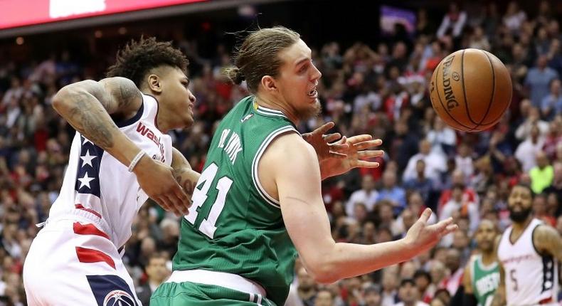 Kelly Oubre (L) of the Washington Wizards defends against Kelly Olynyk of the Boston Celtics on May 12, 2017