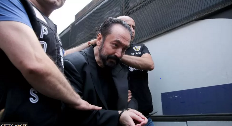 Adnan Oktar in police grips