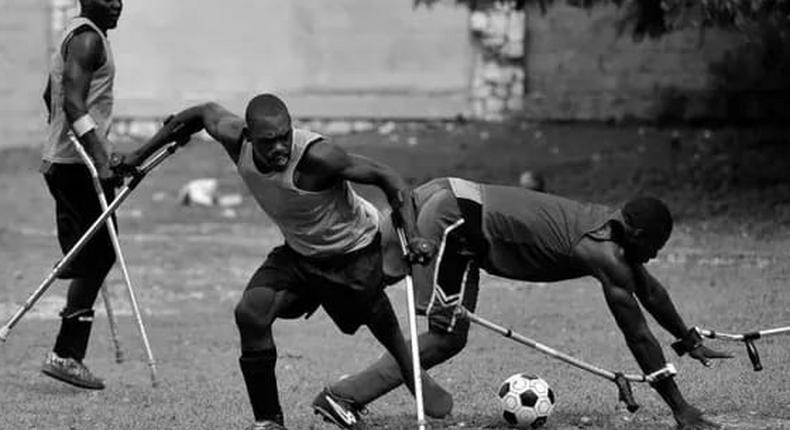People living with disability playing football. 