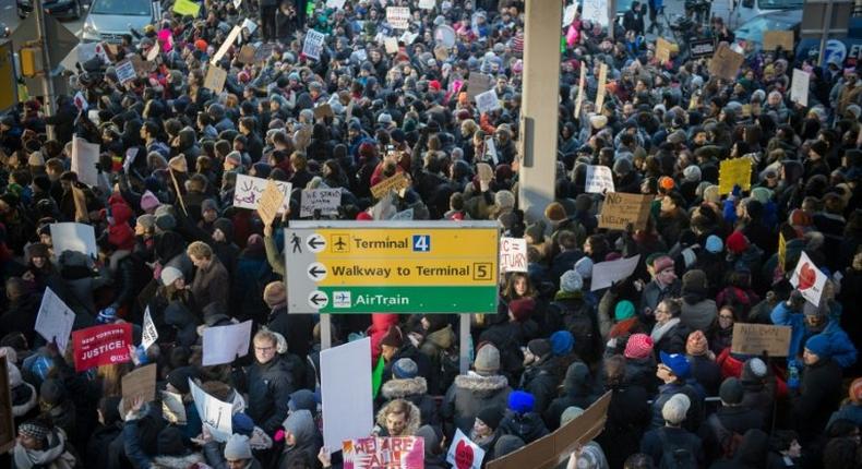 Demonstrators at JFK International Airport protest President Donald Trump's executive order suspending refugee arrivals and imposing tough controls on some travellers