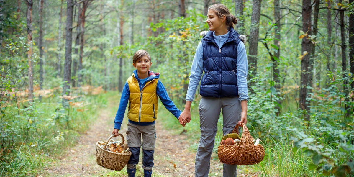 Mushrooms picking, season for mushrooms - lovely kids with picked fresh edible mushrooms