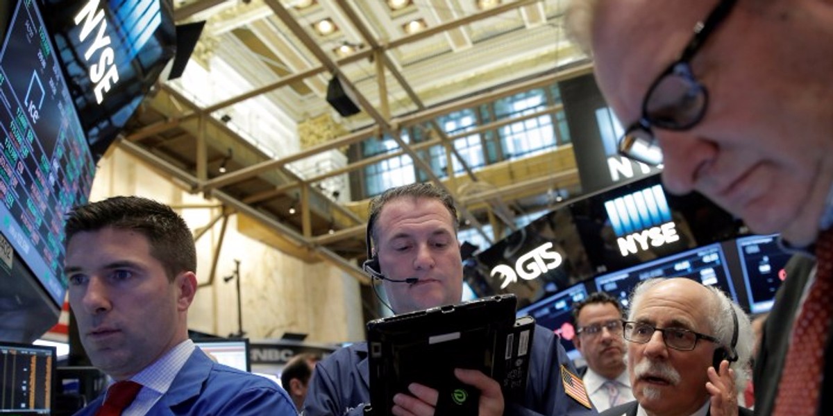 Traders work on the floor of the New York Stock Exchange (NYSE) in New York City