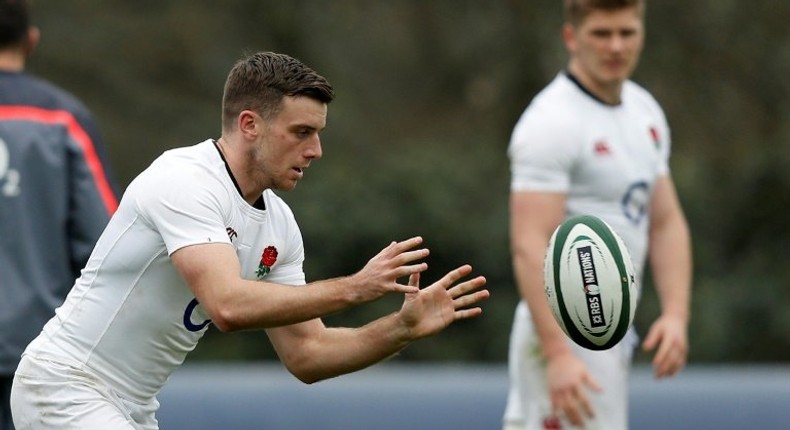 England's centre Owen Farrell (R) watches fly-half George Ford during a team training session at Pennyhill Park in Bagshot, on March 16, 2017