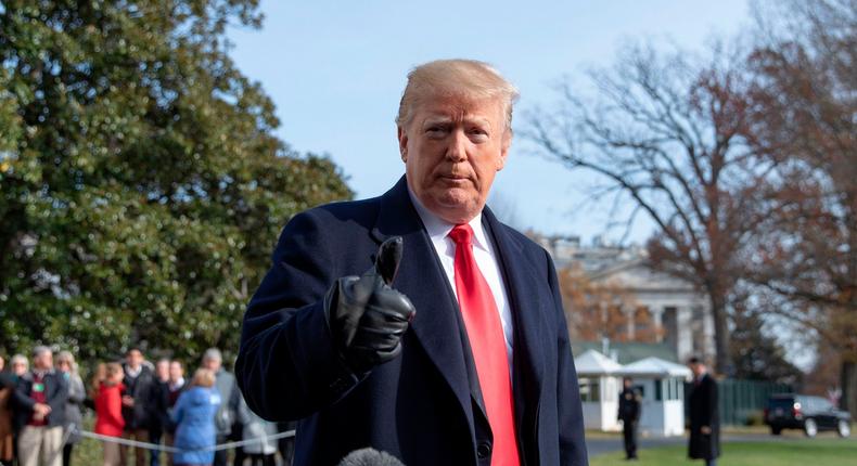 US President Donald Trump talks to reporters prior to boarding Marine One as he departs the White House in Washington, DC on December 8, 2018. - US President Donald Trump on Saturday announced his chief of staff John Kelly would be leaving the administration at the end of the year -- the latest in a series of moves by the Republican leader to change his inner circle of aides. (Photo by Alex Edelman / AFP)