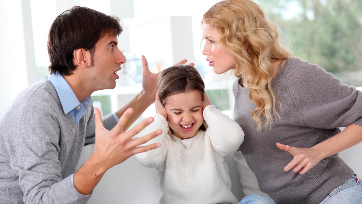 Couple fighting in front of child