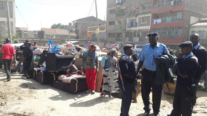 Tenants with their belongings outside as bulldozers flattened their building in Kayole's Nyama Villa area 