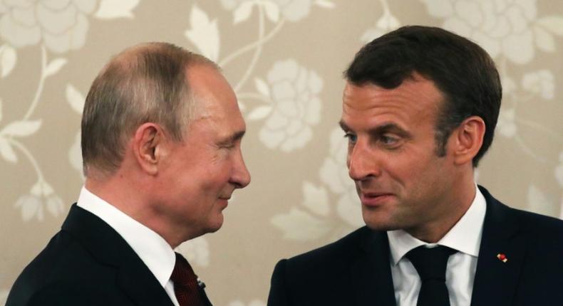Macron (R) who hosted his Russian counterpart in grand style at the palace of Versailles in 2017, will this time meet Putin at his official holiday residence in Bregancon in southern France