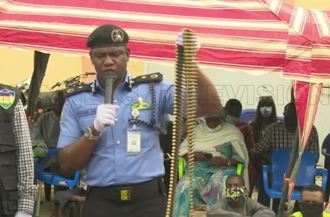 Police spokesperson, Frank Mba, displays the live rounds of ammunition recovered from the suspects [Channels TV]