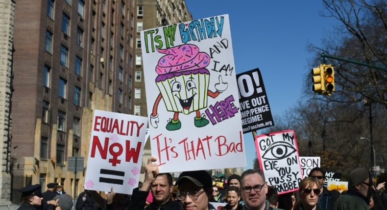 Protestors march down Central Park West in New York City during a Not My President Day rally on February 20, 2017