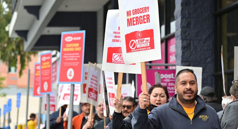 Unionized grocery store workers have rallied against the proposed merger between Kroger and Albertsons.FREDERIC J. BROWN/AFP via Getty Images