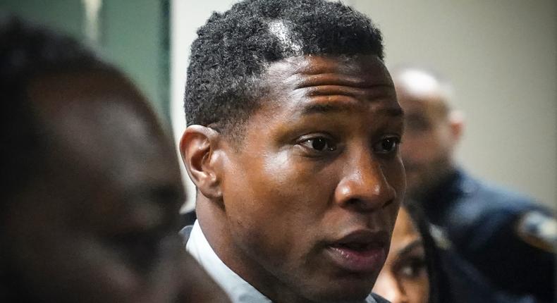 Jonathan Majors, left, returns to court after a lunch break in his domestic assault trial, Tuesday, Dec. 5, 2023, in New York.AP Photo/Bebeto Matthews