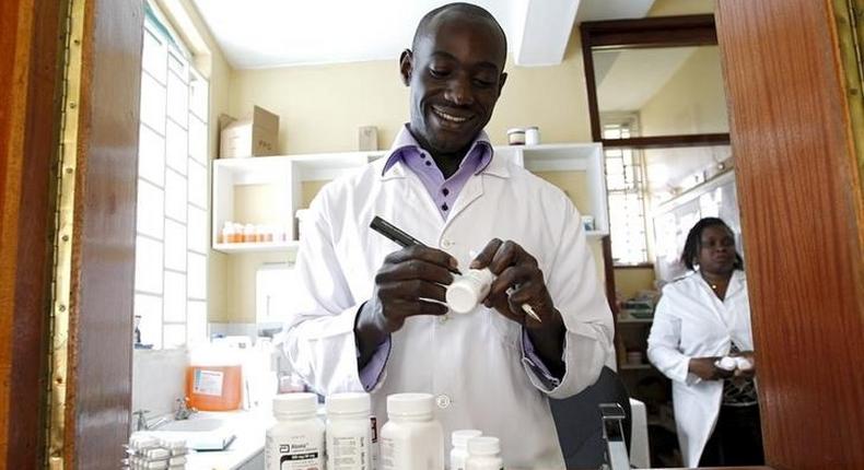 Michael Otieno, a pharmacist, dispenses anti-retroviral (ARV) drugs at the Mater Hospital in Kenya's capital Nairobi, September 10, 2015.      REUTERS/Thomas Mukoya