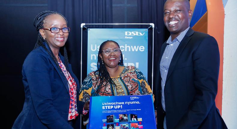 Multichoice Kenya Head of Customer Value Management (CVM), Lucy Mwakalama, Head of Marketing, Celeste Muli (center) and Head of Corporate Affairs Phillip Wahome interact during the official launch of DStv and GOtv Upgrade Campaigns