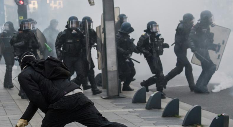 Riot police officers faced off against demonstrators during a yellow vest protest in Nantes, western France, on November 16, 2019.