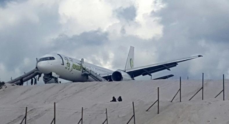 A Toronto-bound Fly Jamaica plane is seen after crash-landing at the Cheddi Jagan International Airport in Georgetown, Guyana on November 9, 2018