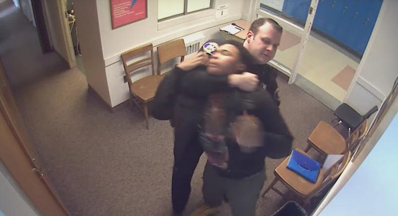 Screenshot from a surveillance video showing police officer Steve Shaulis allegedly abusing a student at Woodland Hills High School in Pennsylvania.