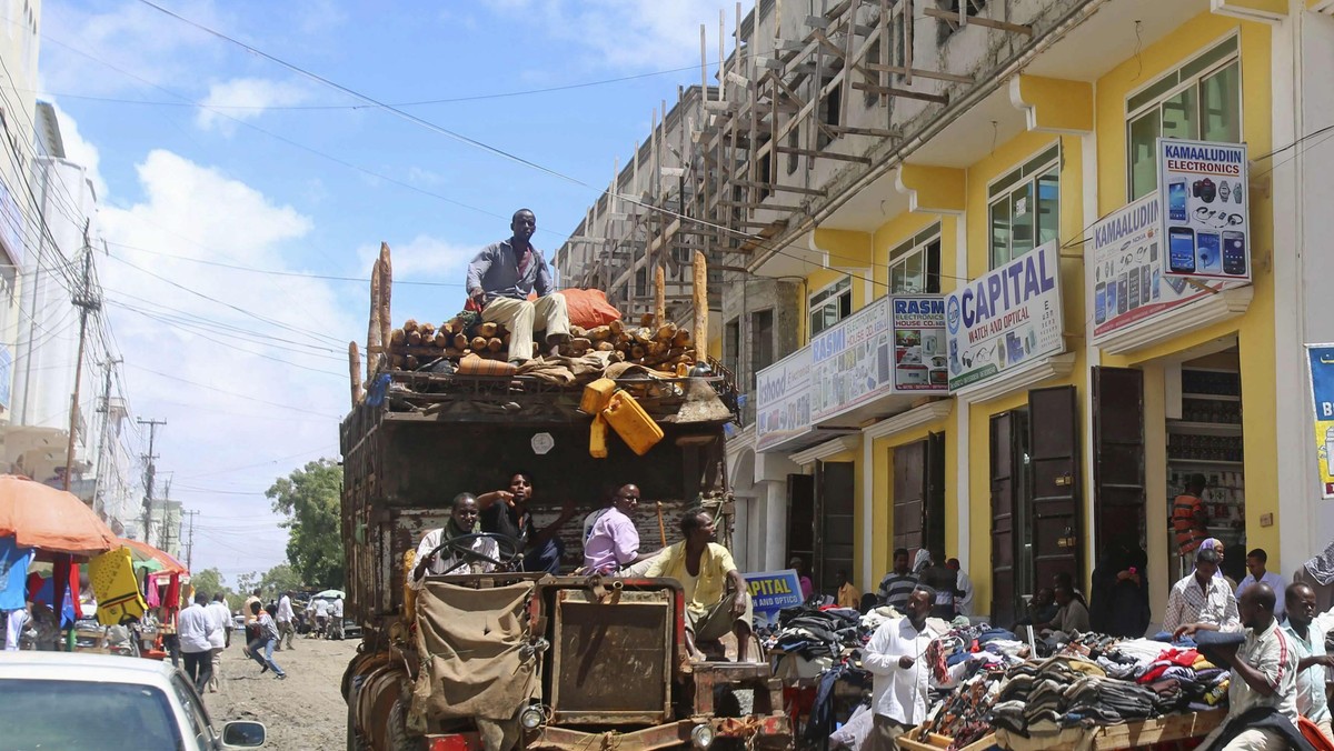 A truck drives through Bakara market in Mogadishu October 5, 2013. Street lamps now brighten some of Mogadishu's battle-scarred roads and couples hold hands at the seaside next to bombed-out beachfront buildings, a scene that would have been unthinkable w