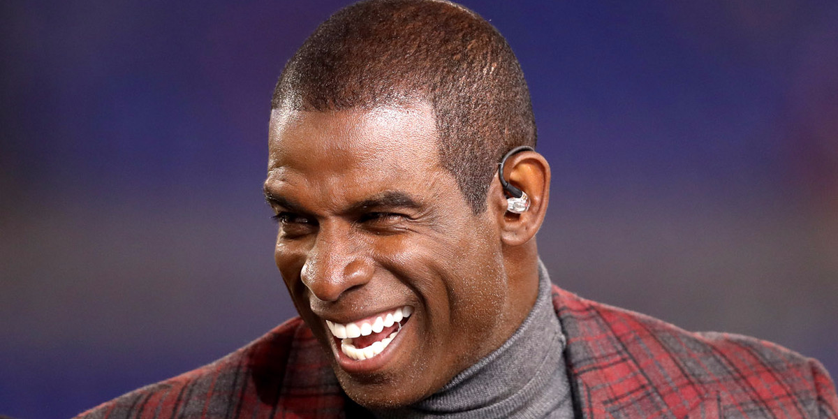 Deion Sanders blasts Tony Romo during live segment for making a joke about Sanders' tackling