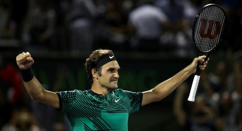 Roger Federer of Switzerland celebrates defeating Nick Kyrgios of Australia in the semi-finals at the Miami Open