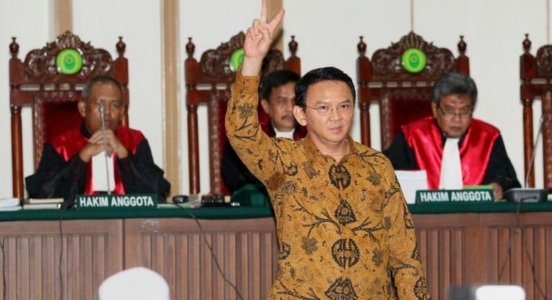 Jakarta's Christian governor Basuki Tjahaja Purnama (C), is on trial accused of blasphemy over remarks he made about the Koran while campaigning