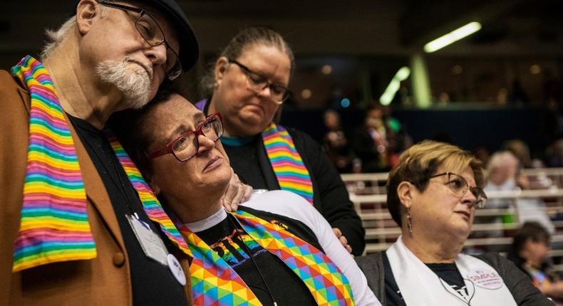 Ed Rowe, left, Rebecca Wilson, Robin Hager and Jill Zundel, react to the defeat of a proposal that would allow LGBT clergy and same-sex marriage within the United Methodist Church at the denominations 2019 Special Session of the General Conference in St. Louis, Mo., Tuesday, Feb. 26, 2019. Americas second-largest Protestant denomination faces a likely fracture as delegates at the crucial meeting move to strengthen bans on same-sex marriage and ordination of LGBT clergy. (AP Photo/Sid Hastings)