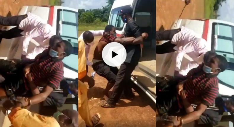 Angry officials tie up stubborn COVID-19 patient with rope before dumping him in ambulance (video)