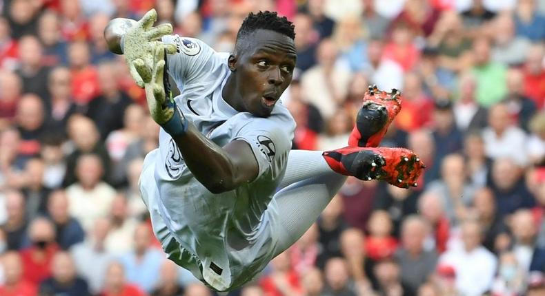 Senegal goalkeeper Edouard Mendy dives while playing for Chelsea against Liverpool in the English Premier League at the weekend