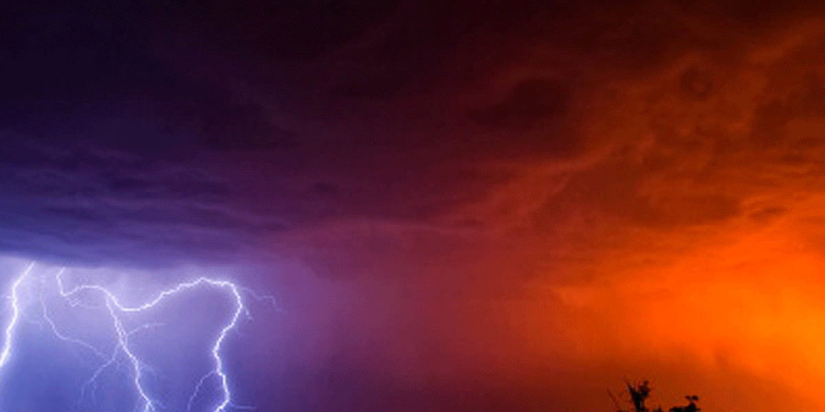 'Fire and Ice' Lightning strikes dropping from the sky (left) while a grass fire caused by a previous strike lights the sky a beautiful red-orange colour (right) in Magaliesburg, South Africa.