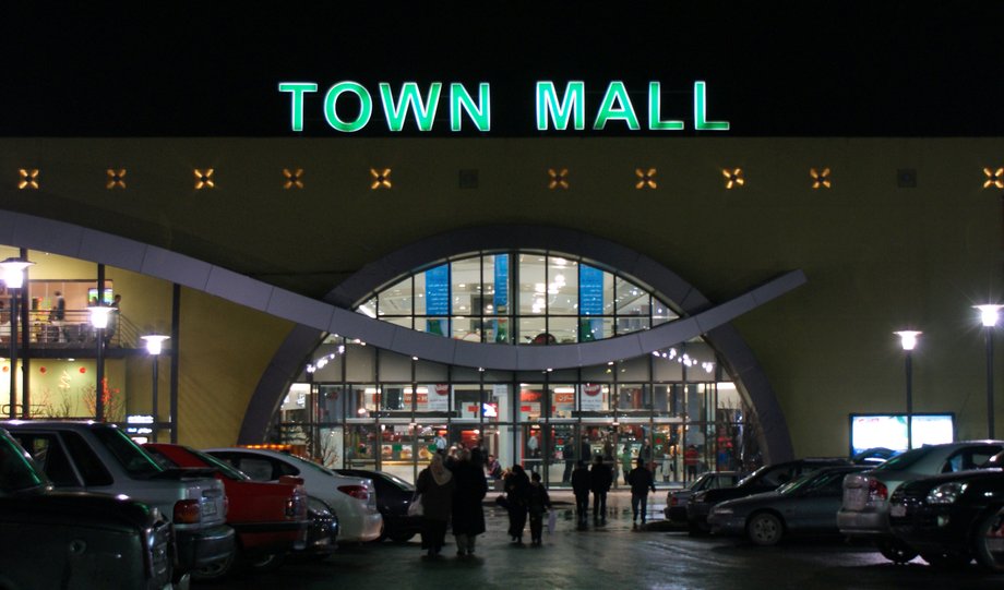 People walk in the Town Mall in Aleppo in 2009.