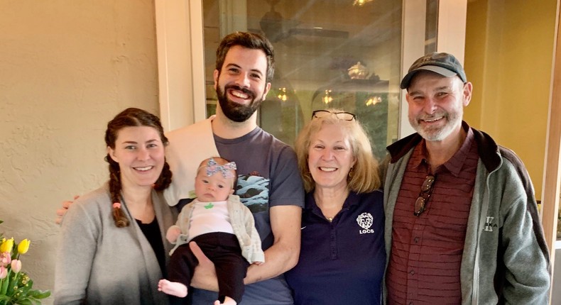 From left, Katie Sandoval Clark; Sandoval Clark's husband, Marshall, who holds their oldest daughter; Sandoval Clark's mom, Barbara Clark; and Barbara Clark's husband, Chris, in March 2020.Courtesy of Barbara Clark