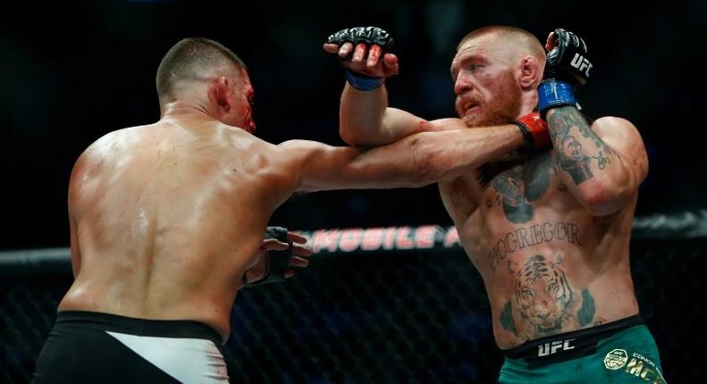 Las Vegas-based Ultimate Fighting Championship (UFC) has shot to sporting prominence by making global stars of fighters such as Conor McGregor (pictured R) and Ronda Rousey