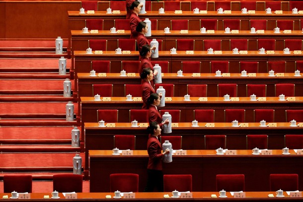 Attendants prepare tea before the opening session of the Chinese People's Political Consultative Con