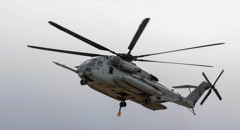 A US Marine Corps CH-53E Super Stallion prepares to execute a cargo lift during an exercise in California on Dec. 1, 2022.US Marine Corps photo by Lance Cpl. Jacob Hutchinson