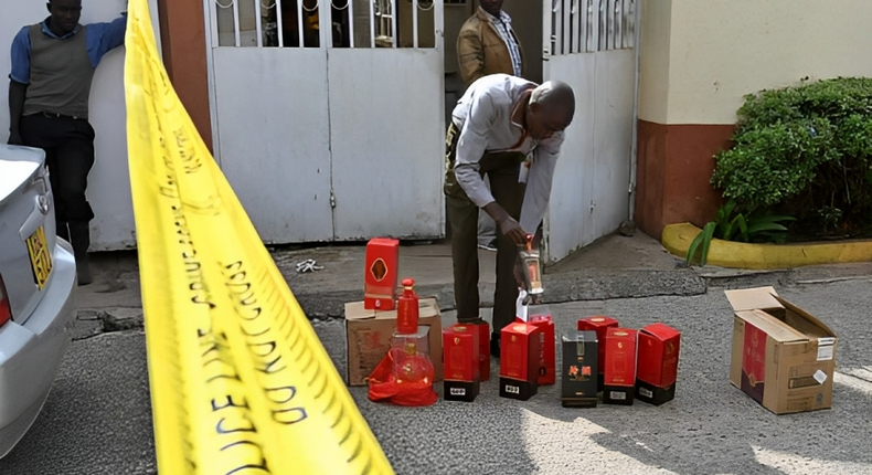 A Kenya Revenue Authority (KRA) official inspects packages of liquor that were seized on January 8, 2019 at a residential estate in Nairobi. Photo credit: Tony Karumba /AFP via Getty Images