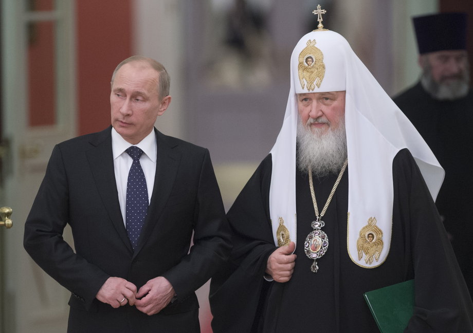Russia's President Vladimir Putin (L) and Patriarch of Moscow and All Russia Kirill arrive for the meeting with Russian Orthodox church bishops in Moscow February 1, 2013.