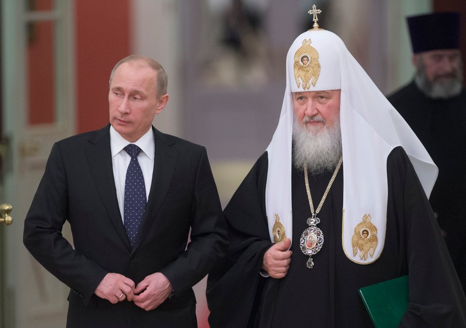 Russia's President Vladimir Putin (L) and Patriarch of Moscow and All Russia Kirill arrive for the meeting with Russian Orthodox church bishops in Moscow February 1, 2013.