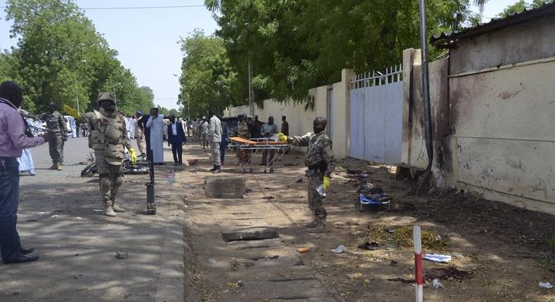 Security officers secure the site of a suicide bombing in Ndjamena, Chad, June 15, 2015. At least 27 people, including four suspected Boko Haram Islamist fighters, were killed and 100 others were injured on Monday in two attacks in Chad's capital, N'Djamena, which the government blamed on the Nigerian militant group. REUTERS/Moumine Ngarmbassa