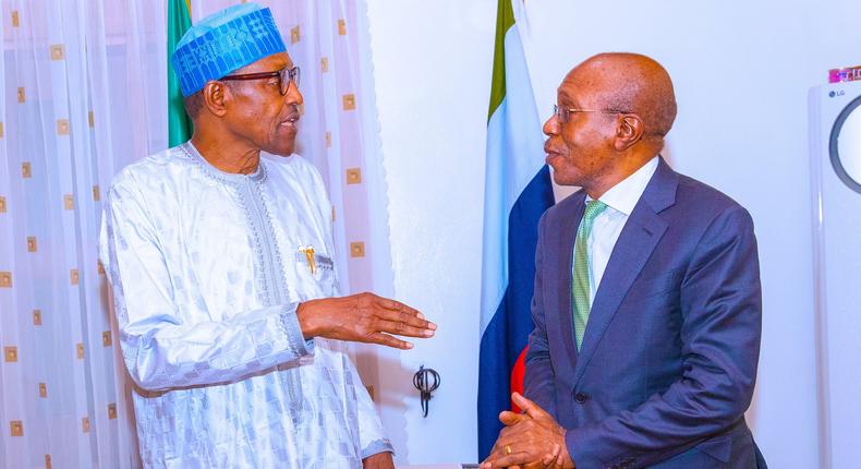 Former President Muhammadu Buhari and suspended CBN governor, Godwin Emefiele.