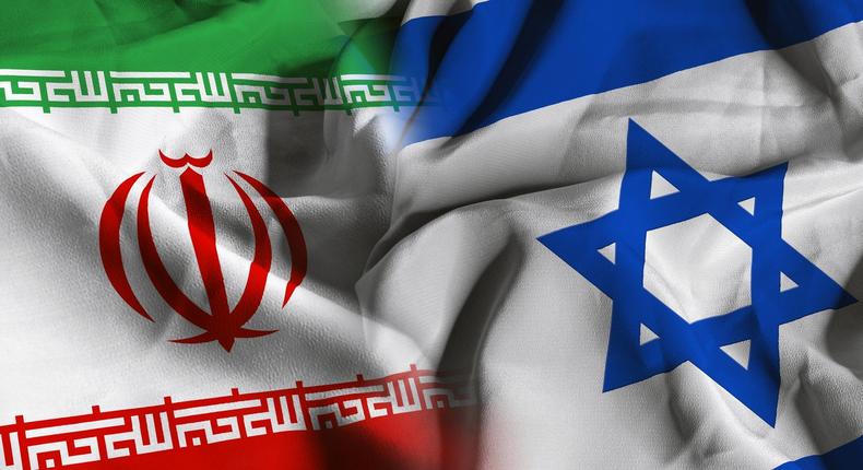 The flags of Iran, left, and Israel, right.Manuel Augusto Moreno/Getty Images