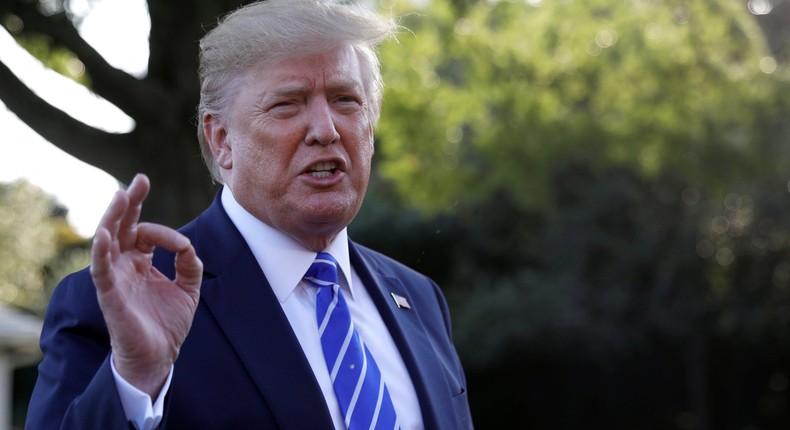 President Donald Trump talks with reporters on the South Lawn of the White House in Washington, Friday, Aug. 30, 2019, en route to Camp David in Maryland. (AP Photo/Carolyn Kaster)