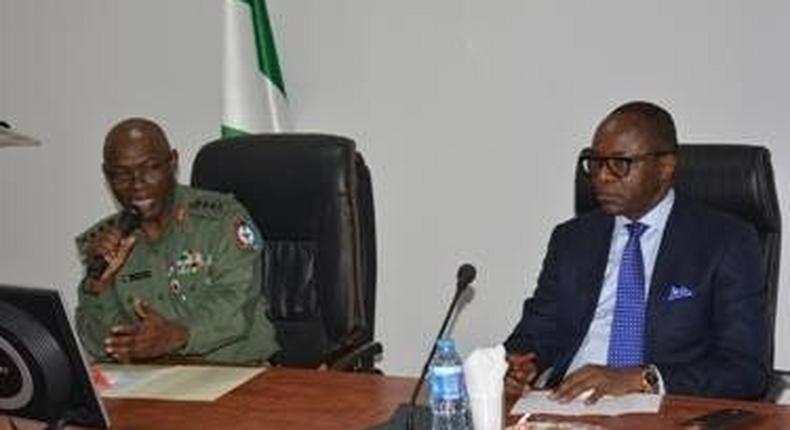 Ibe Kachikwu (right) at the Defence Headquarters in Abuja on Tuesday, February 2, 2016.