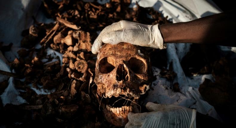 Relatives of victims of Rwanda's 1994 genocide recently recovered remains ahead of a mass burial in Gasabo, a suburb of the capital Kigali, in May 2019