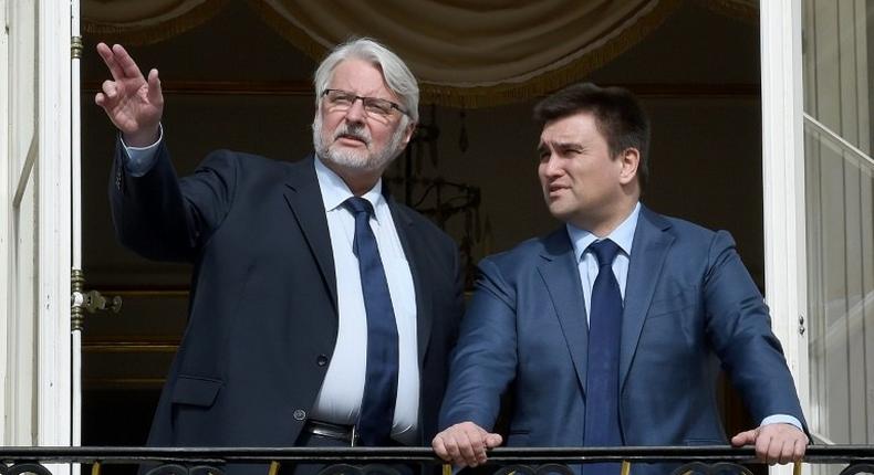 Poland's Foreign Minister Witold Waszczykowski (L) and his counterpart from Ukraine Pavlo Klimkin talk at the balcony of Lazienki palace in Warsaw on March 15, 2017