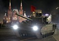 Russian servicemen operate "Armata" main battle tank during a rehearsal for the Victory parade on Moscow's Red Square