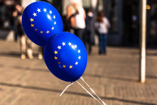 Close-Up Of Blue Balloons On Street